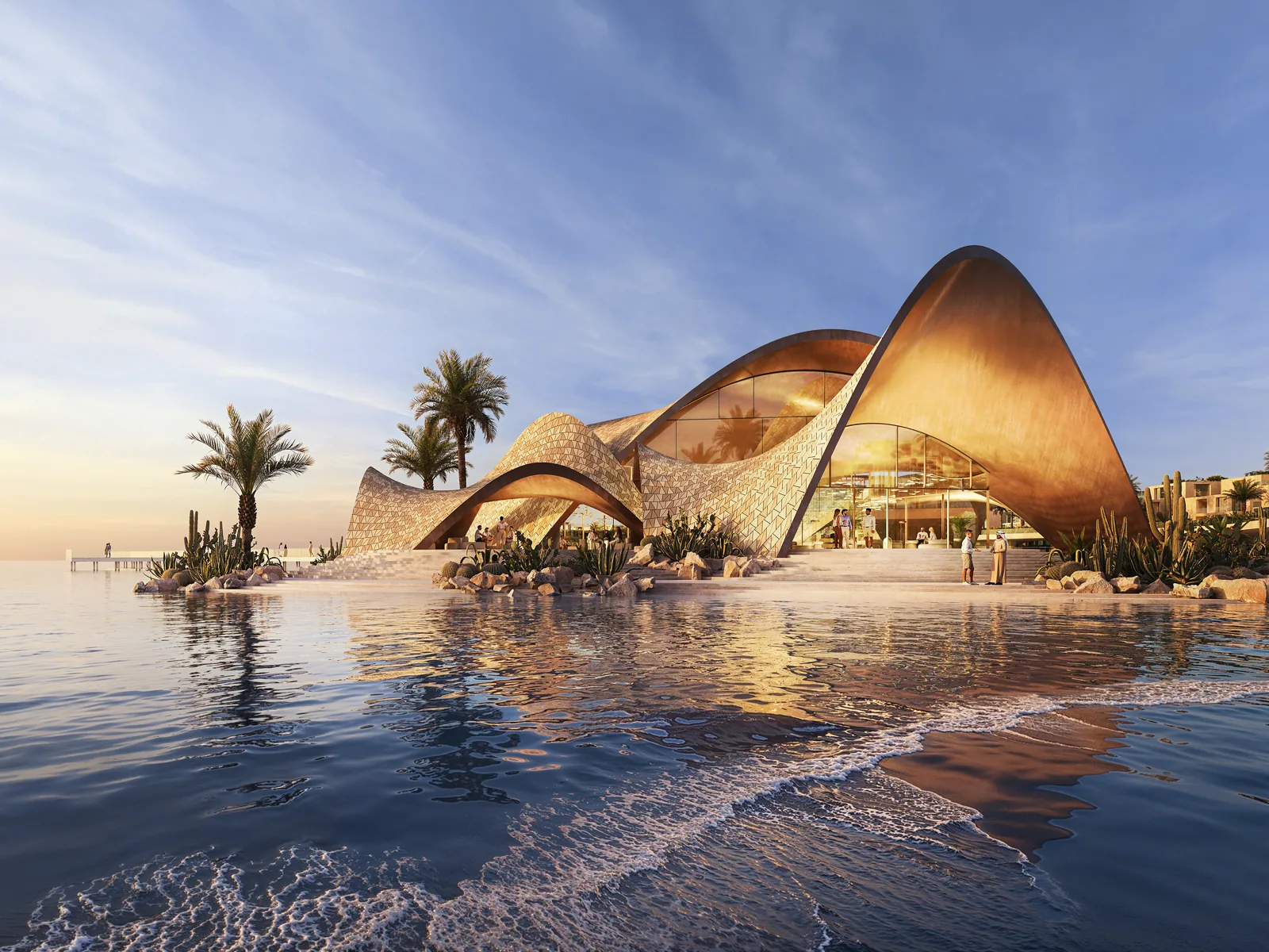 The shell-roofed beach club at the water's edge at sunset