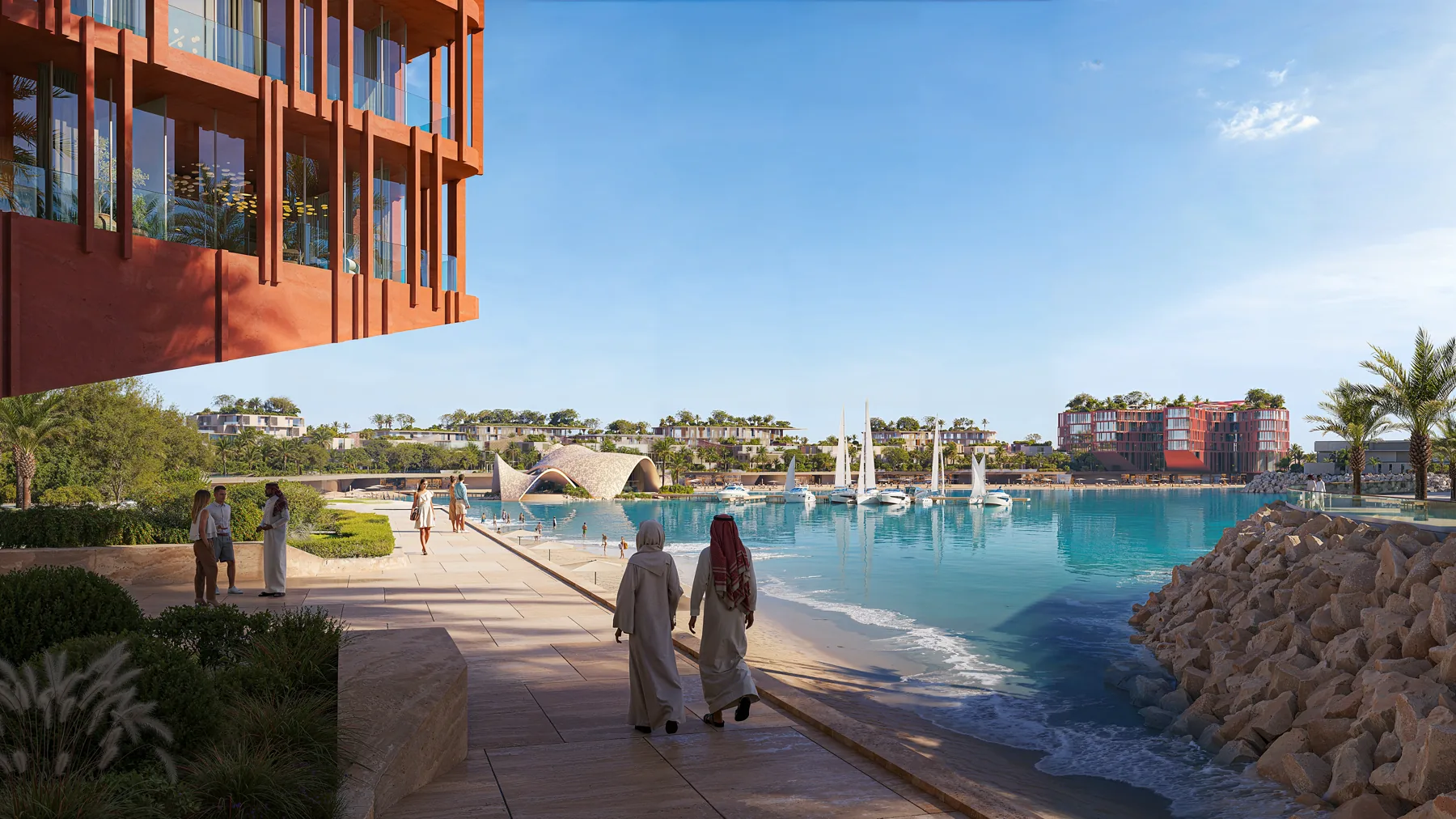 Waterfront promenade beside the lagoon, with moored sailing boats and the beach club beyond
